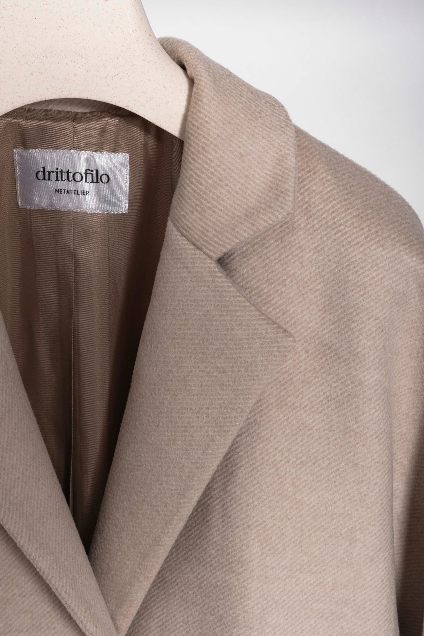 Cappotto in lana panna con cintura